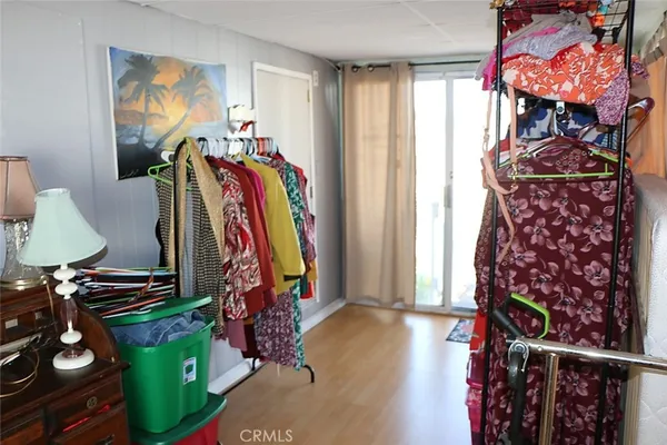 a view of a back yard of the house and cars parked
