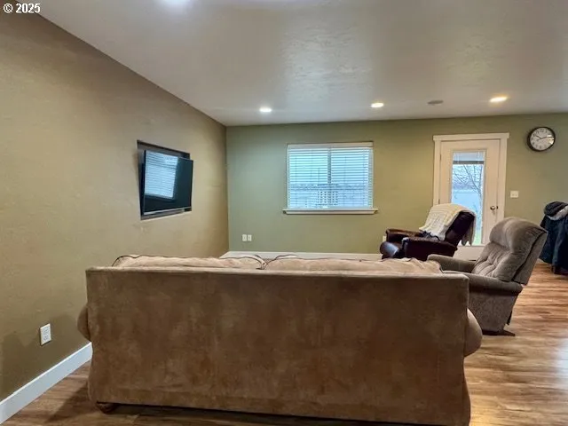 a living room with granite countertop furniture a window and a couch
