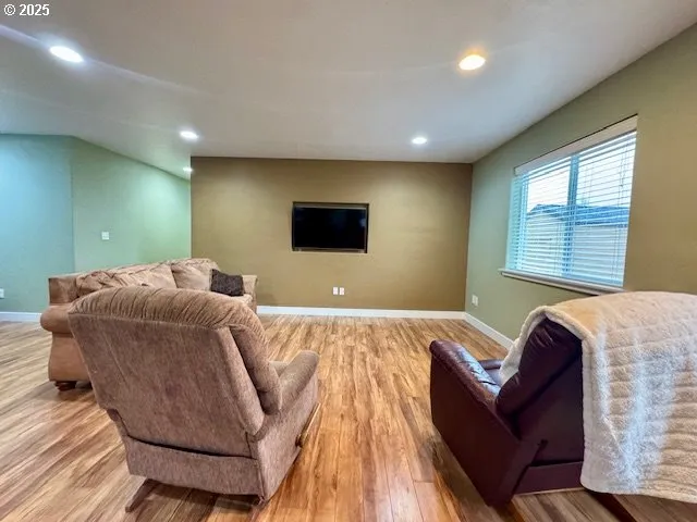 a bed sitting in a room next to a window