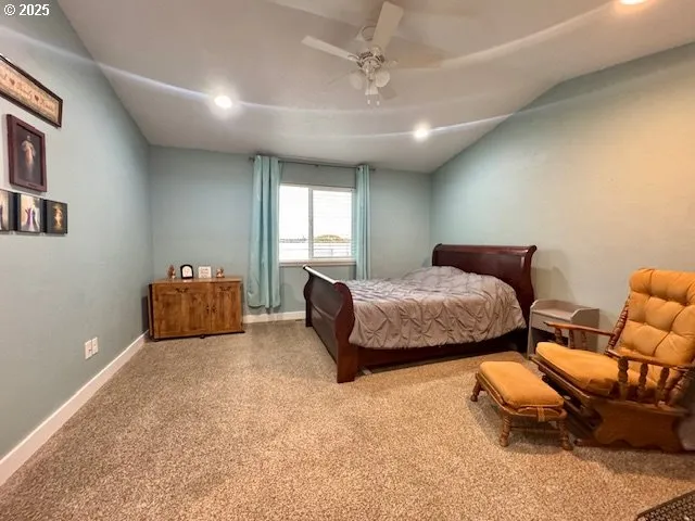 a bedroom with furniture and a chandelier