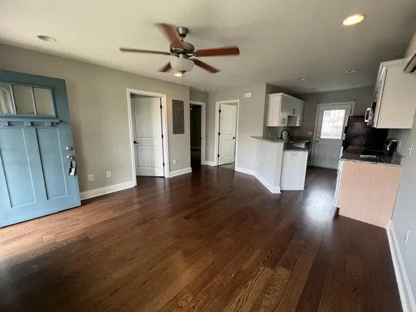 a view of a living room hardwood and wooden floor