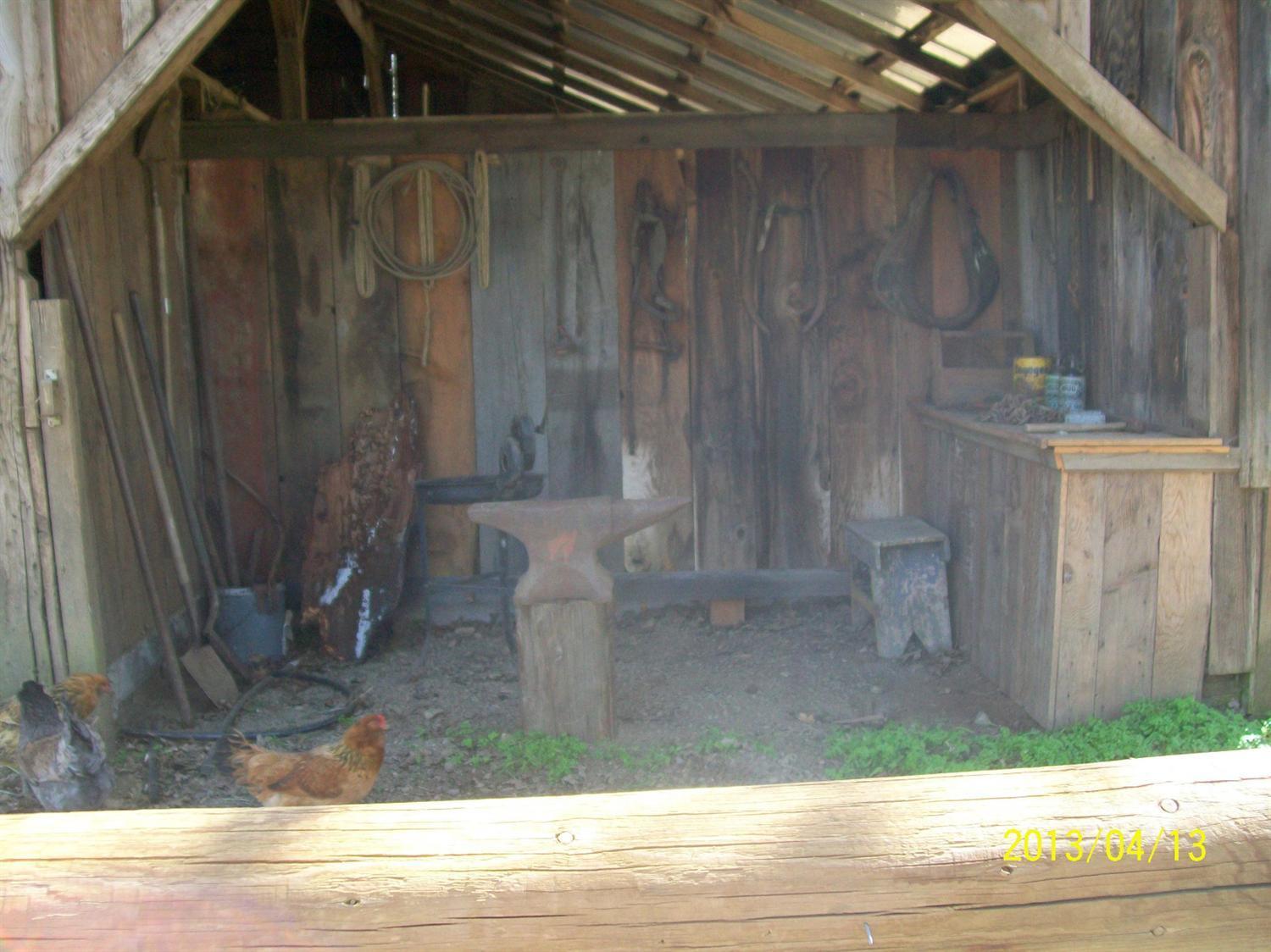 5685 Holland Loop Road Cave Junction, OR 97523 - Photo 16 of 18 Extra area at end of barn, used as work