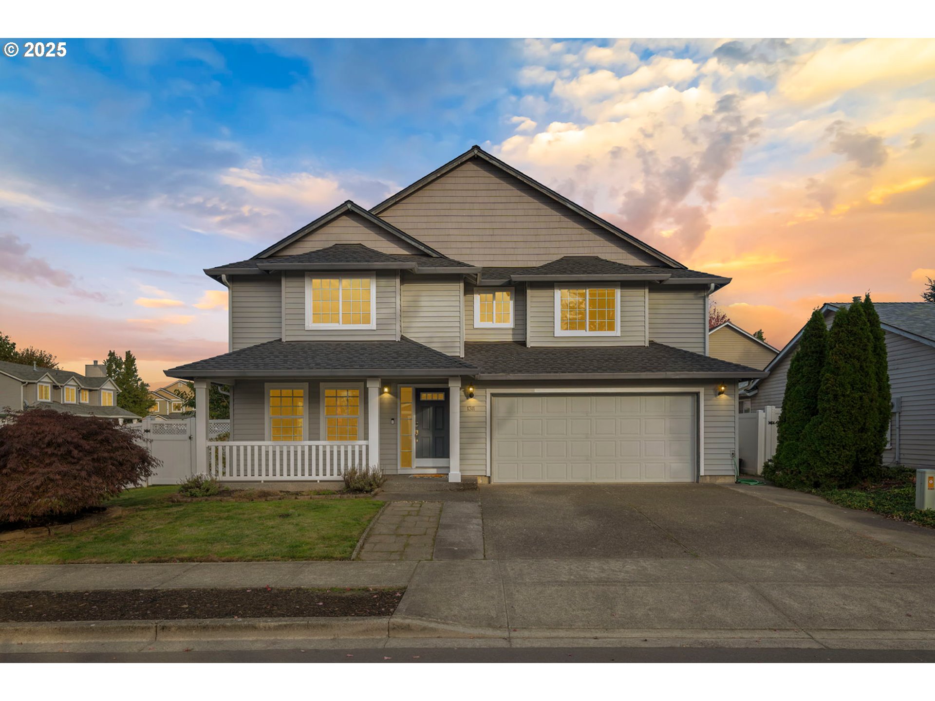 1311 Northwest 26th Avenue Battle Ground, WA 98604 - Photo 1 of 44 a front view of a house with a garden
