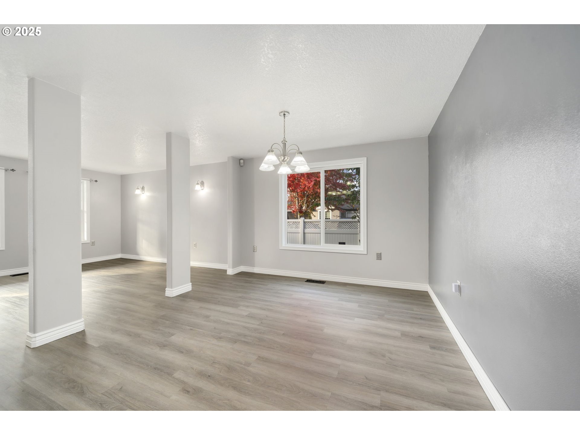 1311 Northwest 26th Avenue Battle Ground, WA 98604 - Photo 11 of 44 a view of an empty room with window and wooden floor