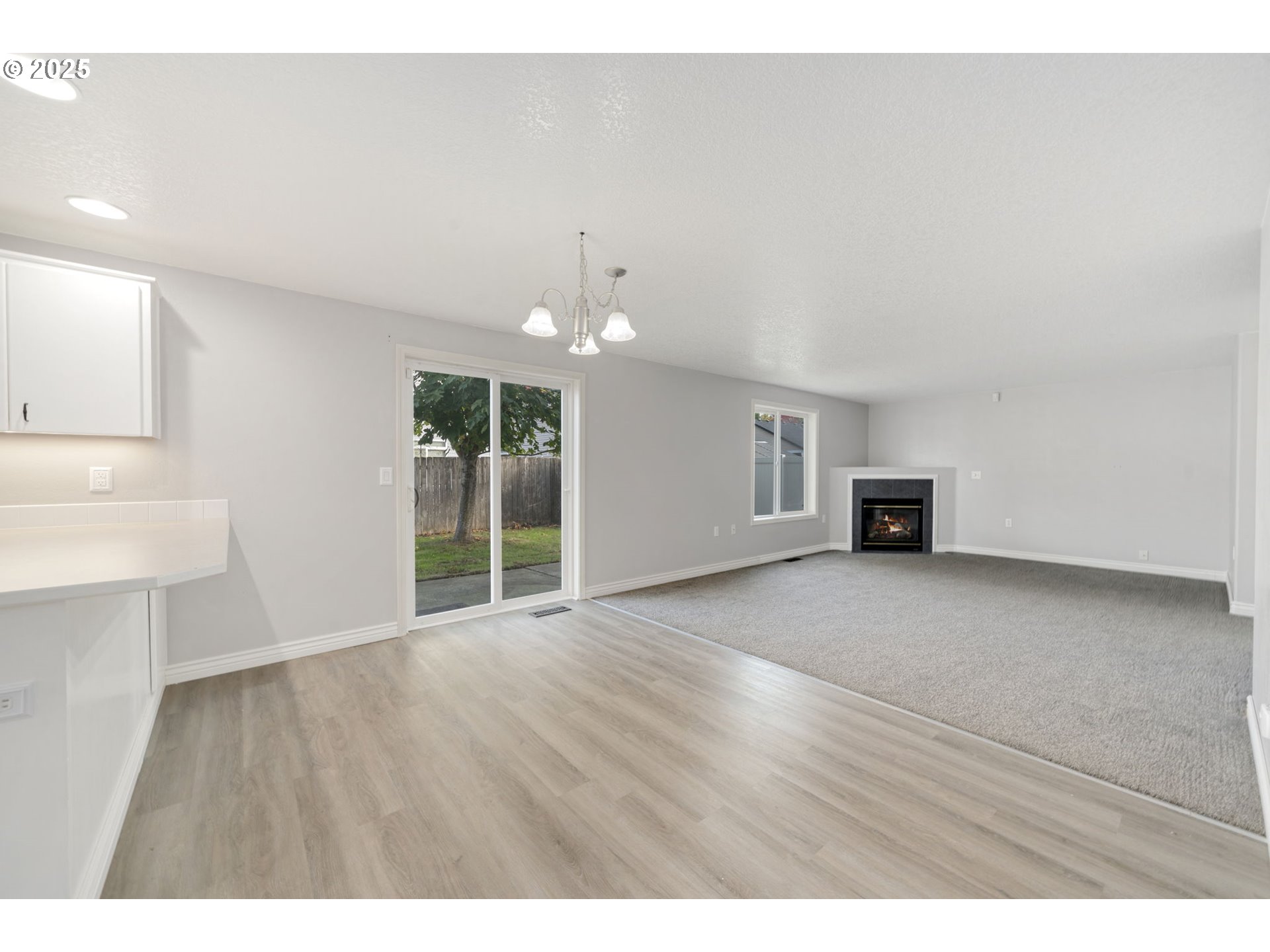1311 Northwest 26th Avenue Battle Ground, WA 98604 - Photo 13 of 44 a view of a livingroom with wooden floor and a ceiling fan