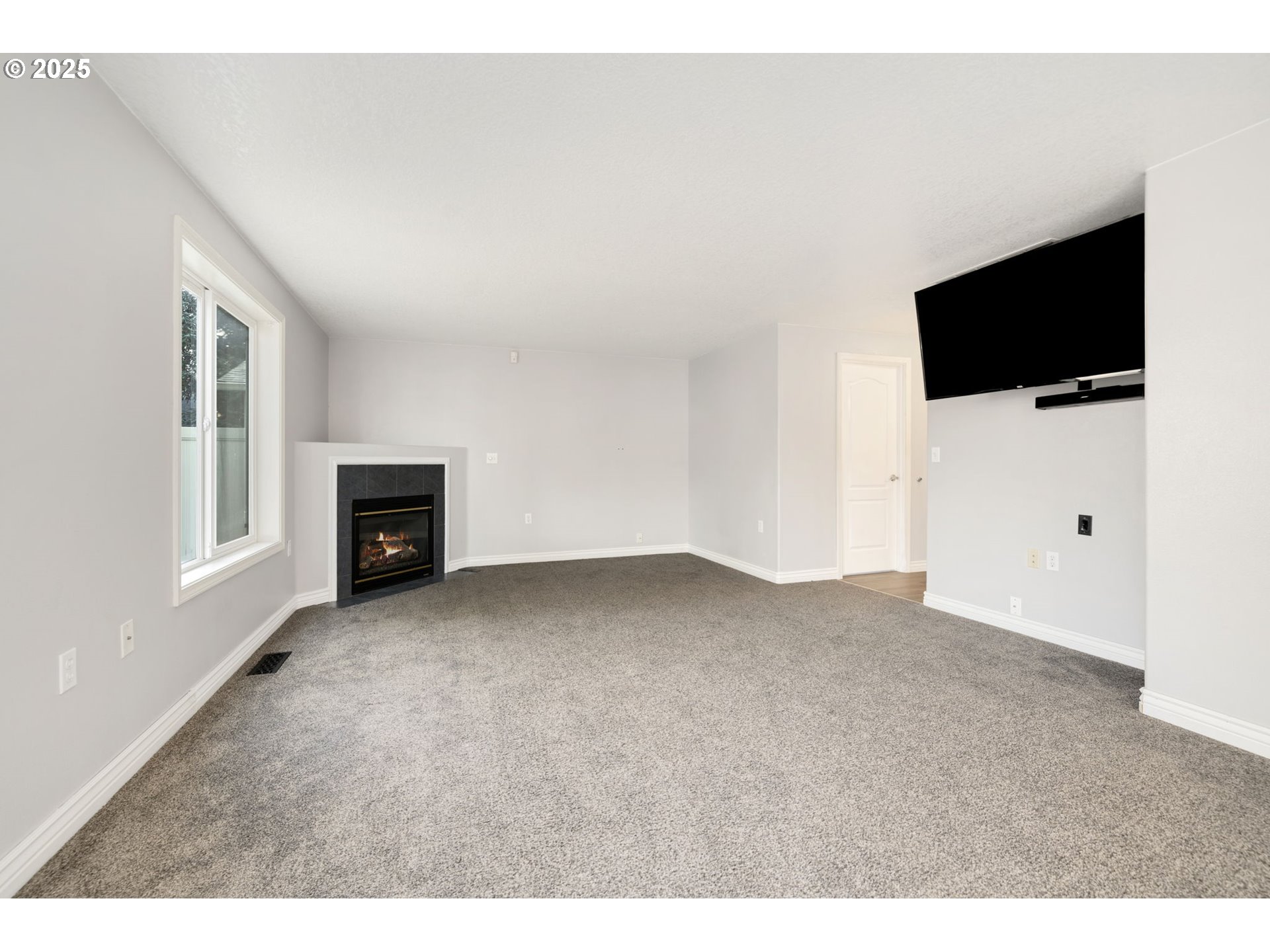 1311 Northwest 26th Avenue Battle Ground, WA 98604 - Photo 15 of 44 a view of an empty room with a flat screen tv