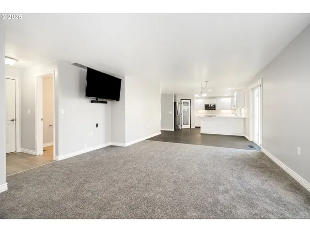 a view of a livingroom with a flat screen tv