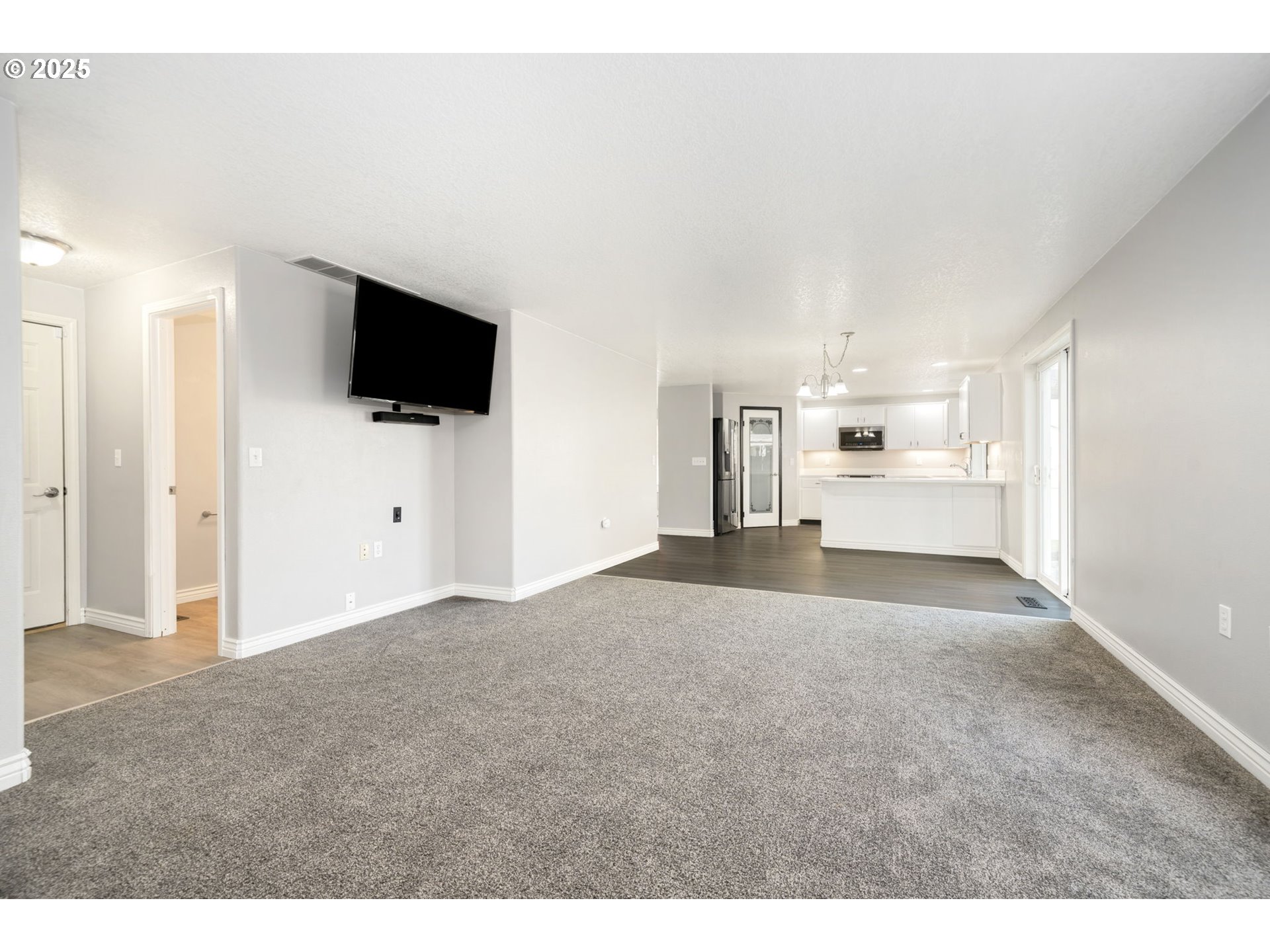 1311 Northwest 26th Avenue Battle Ground, WA 98604 - Photo 16 of 44 a view of a livingroom with a flat screen tv