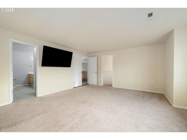 a view of a livingroom with a flat screen tv