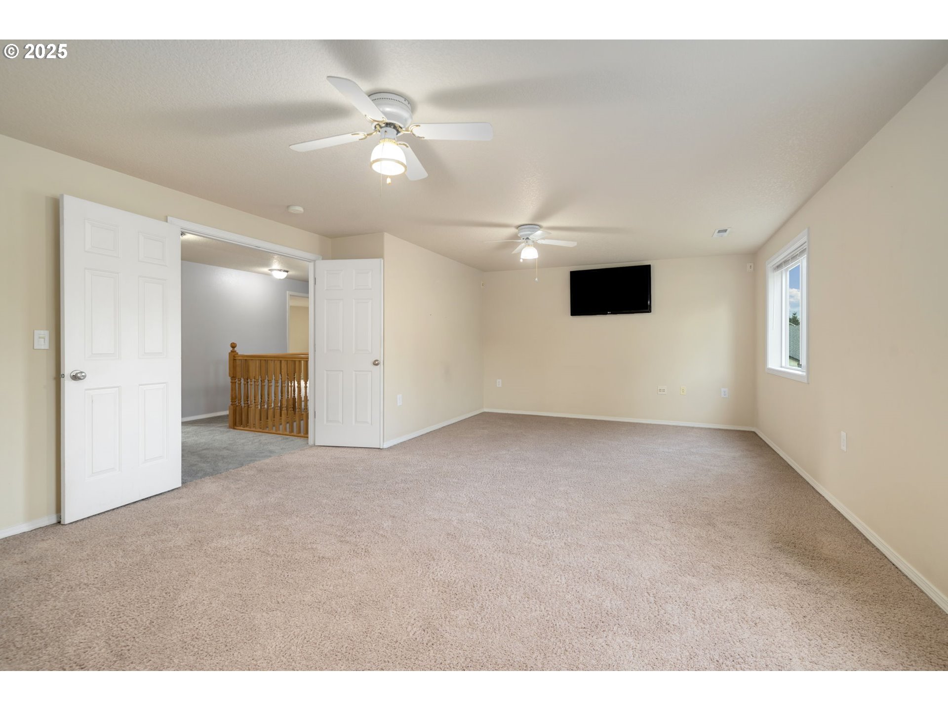 1311 Northwest 26th Avenue Battle Ground, WA 98604 - Photo 30 of 44 a view of a livingroom with a ceiling fan and window