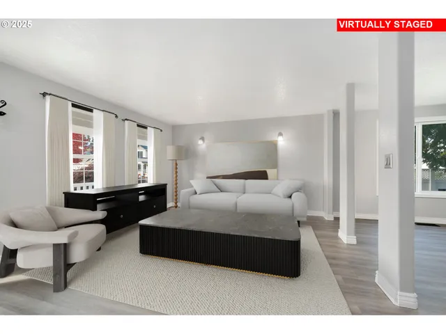 a spacious bedroom with a bed a couch and a window