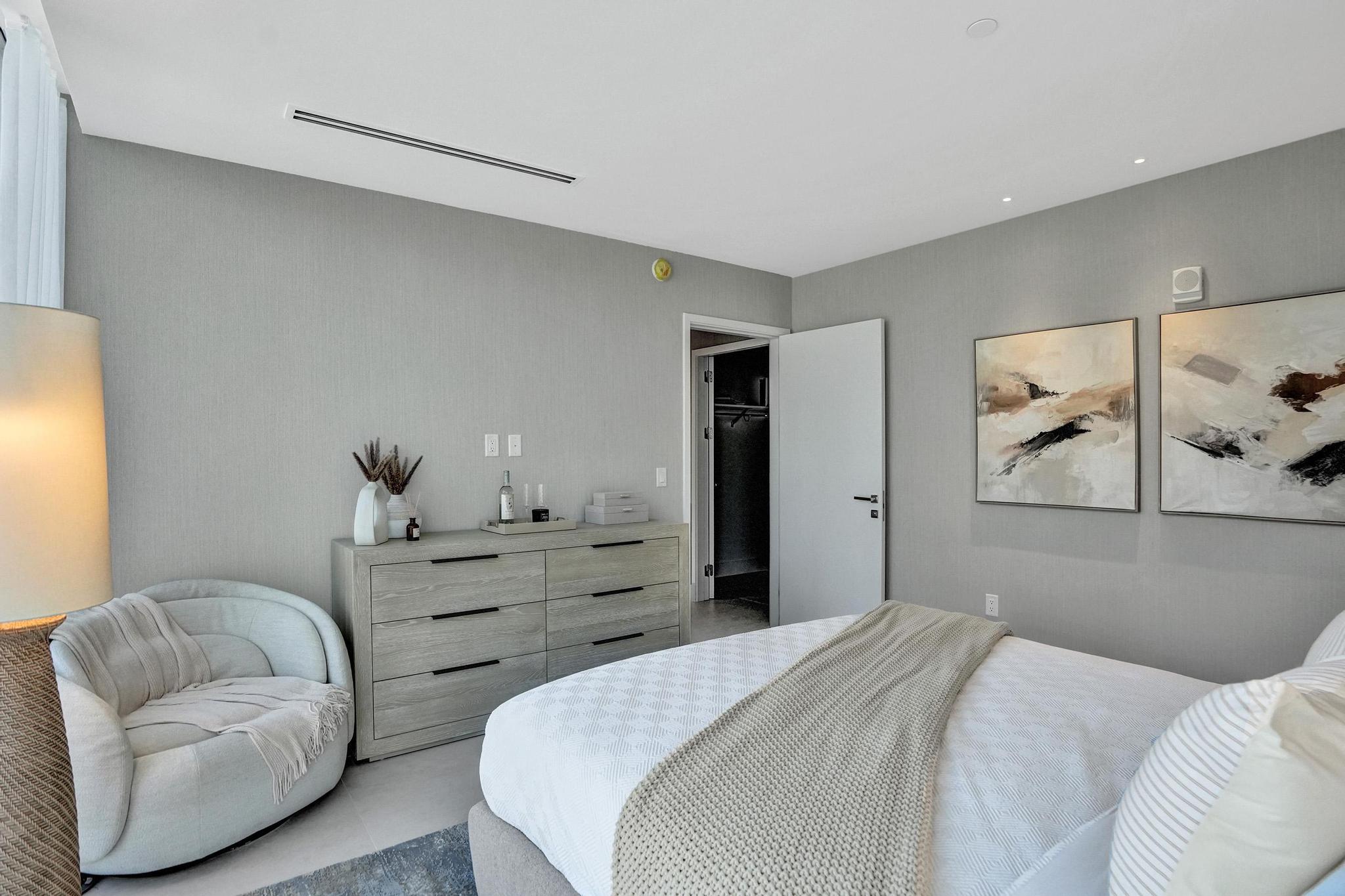 407 North Riverside Drive, Unit 203 Pompano Beach, FL 33062 - Photo 23 of 69 a bedroom with a bed and couch