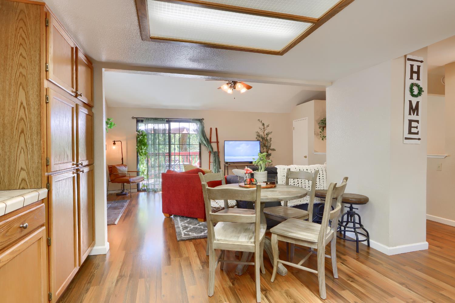 50840 Smoke Tree Trail Bass Lake, CA 93604 - Photo 18 of 43 a view of a dining room with furniture window and wooden floor
