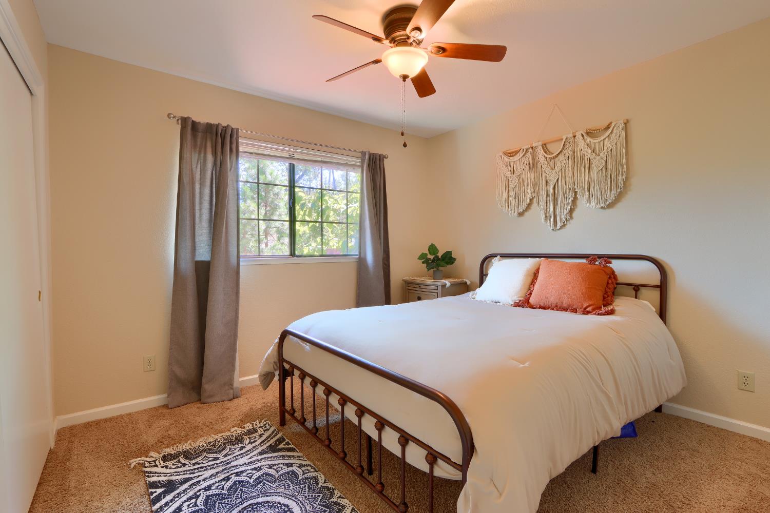 50840 Smoke Tree Trail Bass Lake, CA 93604 - Photo 22 of 43 a bedroom with a bed and a window