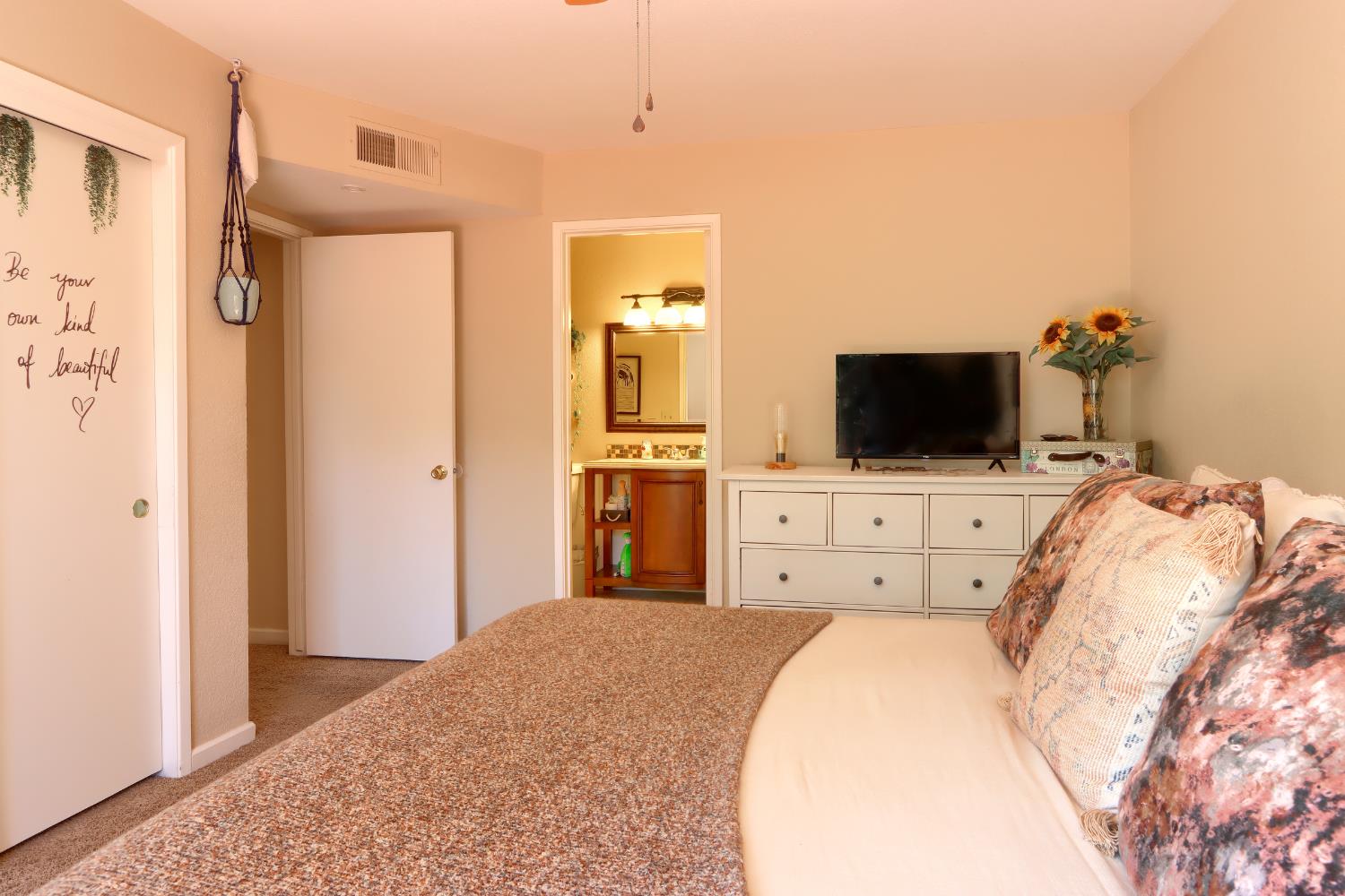 50840 Smoke Tree Trail Bass Lake, CA 93604 - Photo 29 of 43 a bedroom with a bed and a flat screen tv