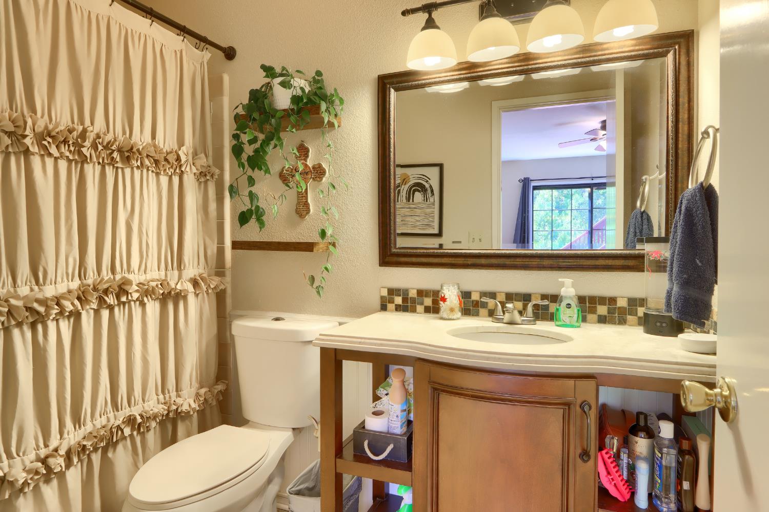 50840 Smoke Tree Trail Bass Lake, CA 93604 - Photo 30 of 43 a bathroom with a sink a toilet and a mirror