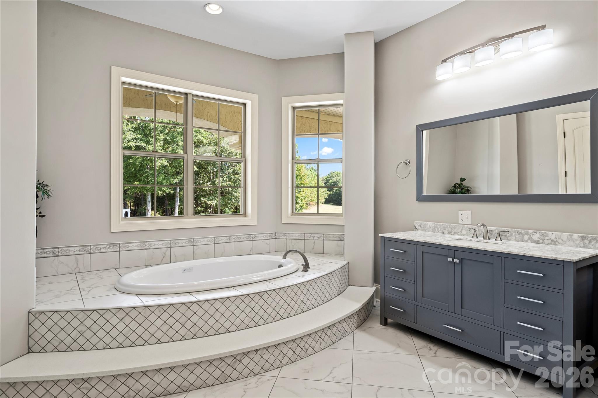 220 Fincher Road Pauline, SC 29374 - Photo 37 of 48 a spacious bathroom with a tub sink and mirror