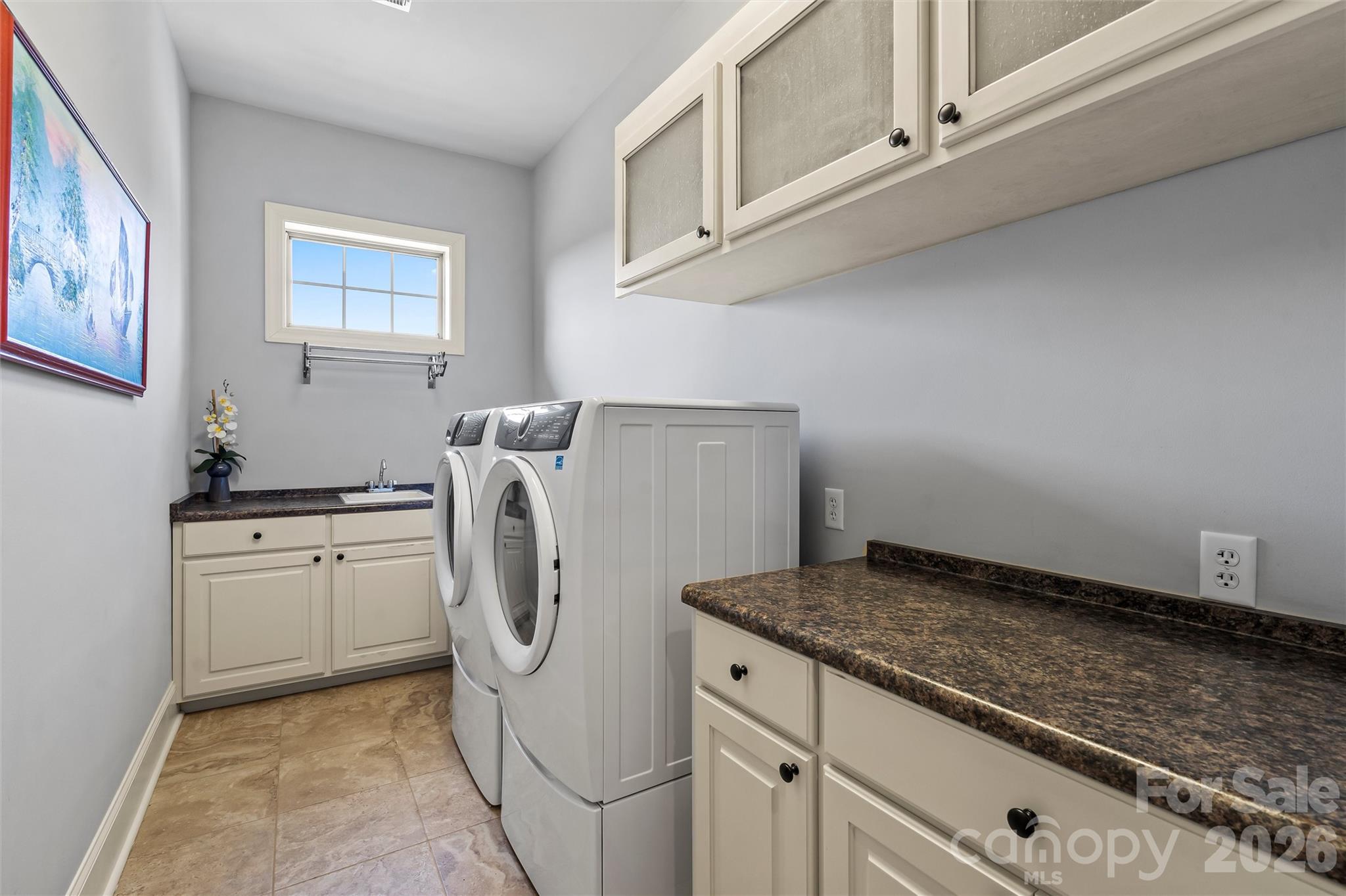 220 Fincher Road Pauline, SC 29374 - Photo 41 of 48 a utility room with granite countertop cabinets washer and dryer