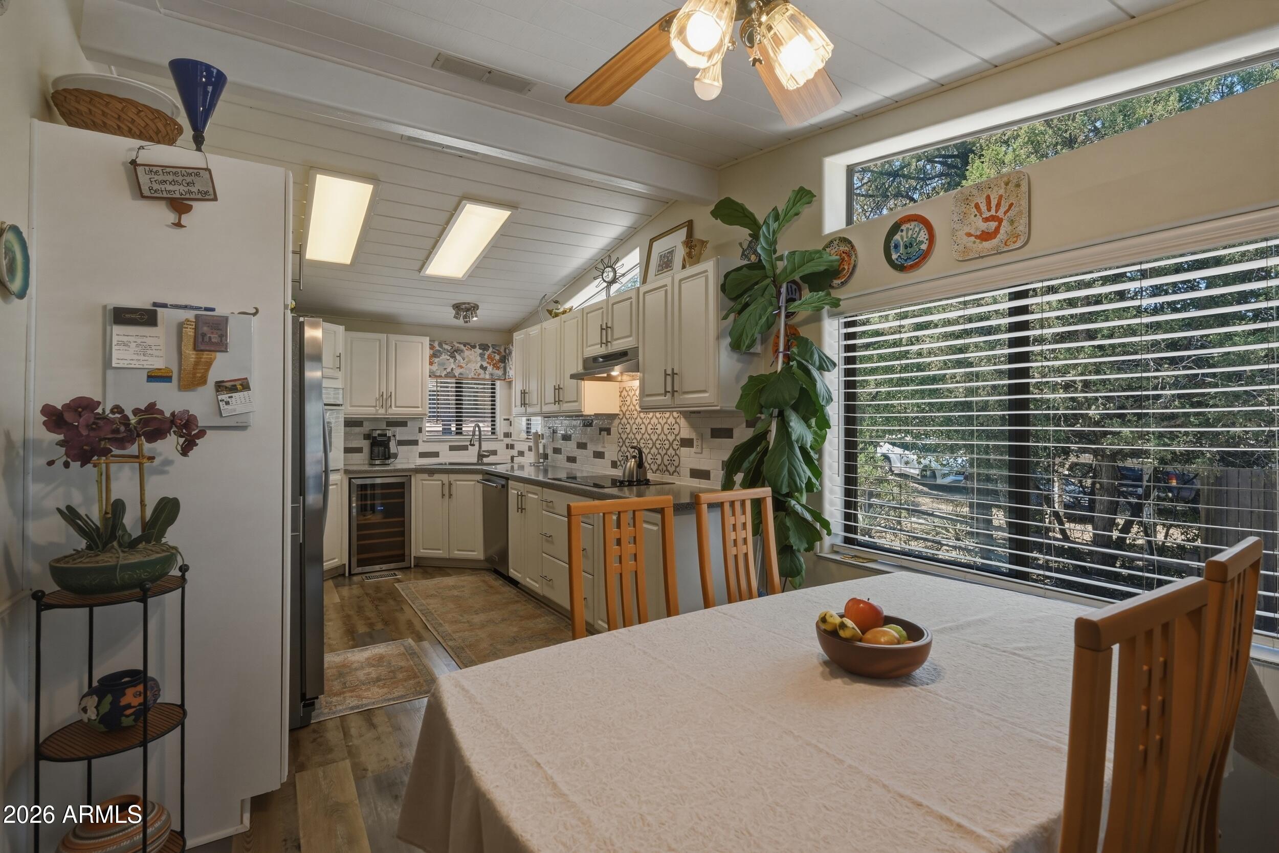 1108 North William Tell Circle Payson, AZ 85541 - Photo 12 of 32 a kitchen with a refrigerator and a stove