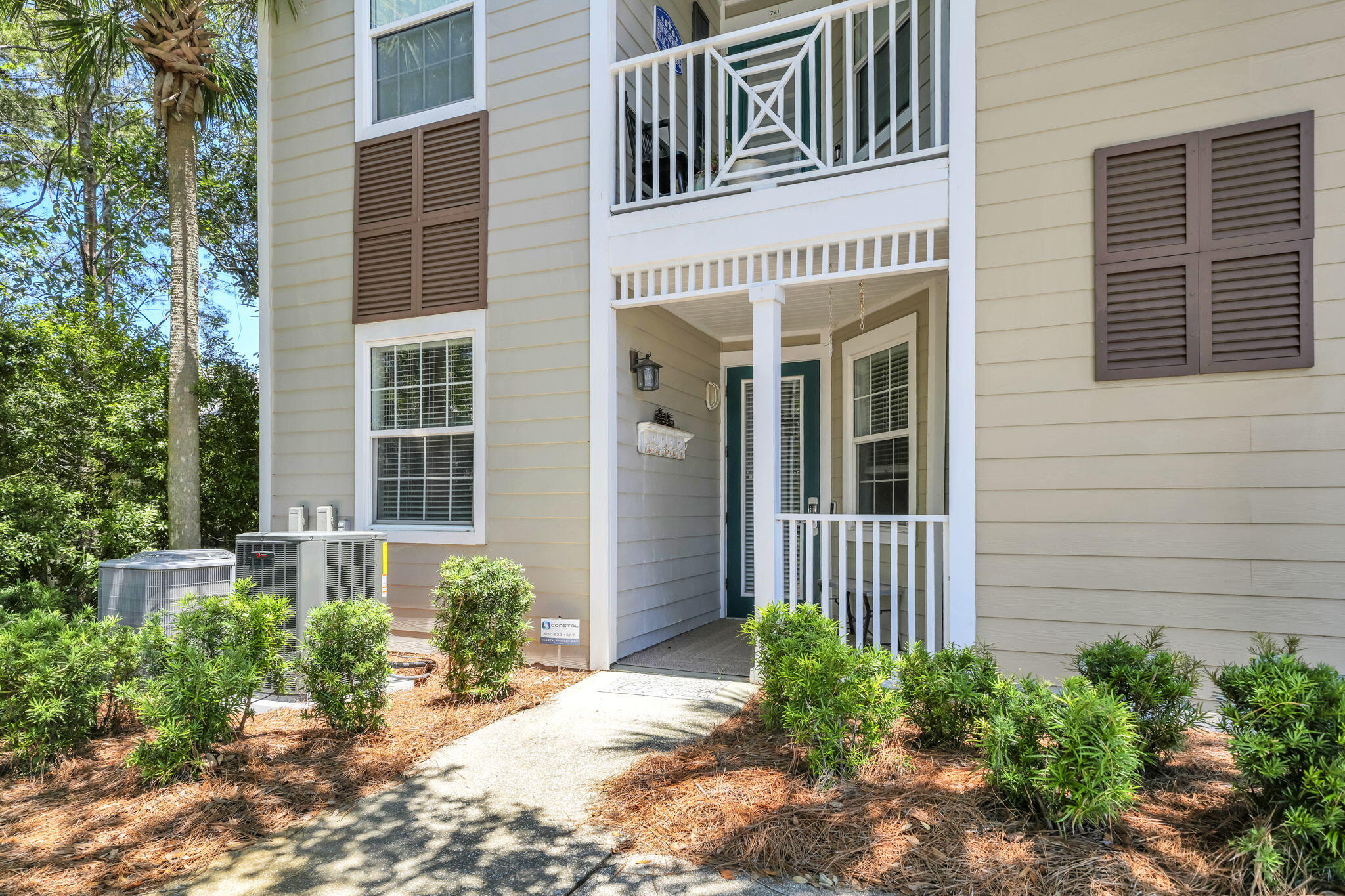 117 Village Boulevard, Unit 711 Santa Rosa Beach, FL 32459 - Photo 3 of 47 a front view of a house with a yard
