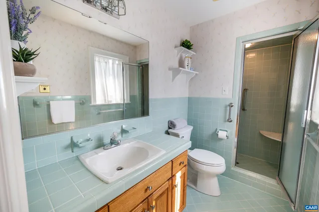 a kitchen with stainless steel appliances granite countertop a sink and a refrigerator