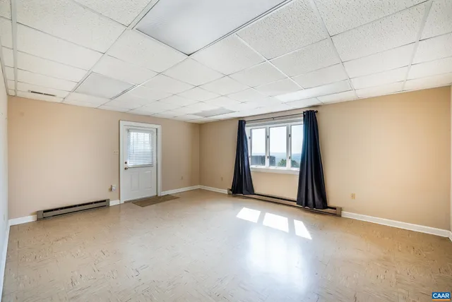 a backyard of a house with lots of green space and mountain view