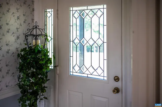 a view of livingroom with workspace and windows
