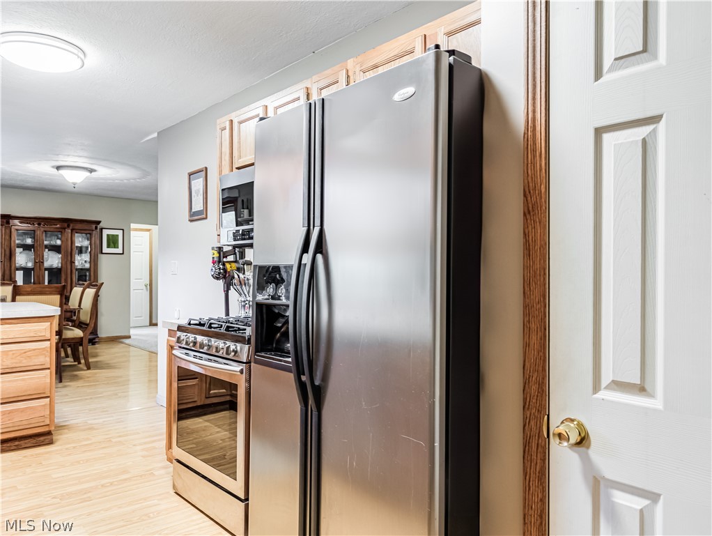 2700 Old Forge Road Kent, OH 44240 - Photo 13 of 34 Kitchen featuring light wood-type flooring and stainless steel appliances
