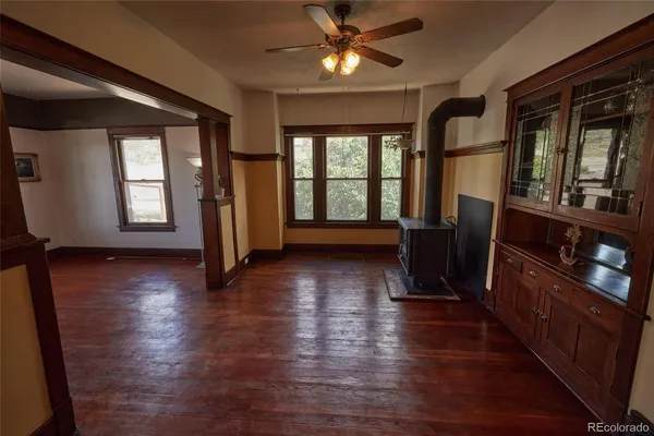 a view of a room with wooden floor and stairs