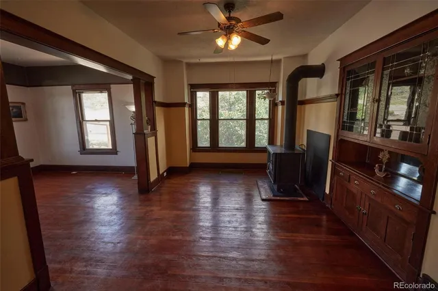 a view of a room with wooden floor and stairs
