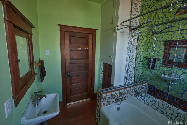 a bathroom with a bathtub and a shower