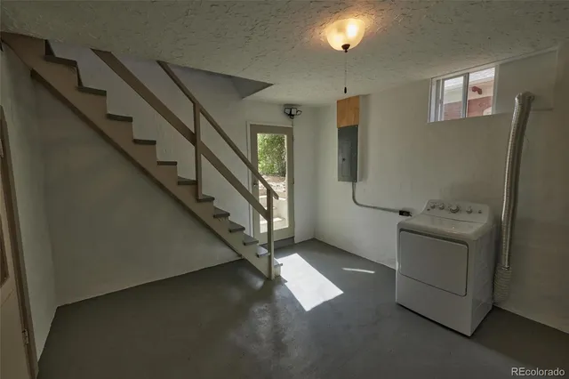 an aerial view of a house with a yard and potted plants