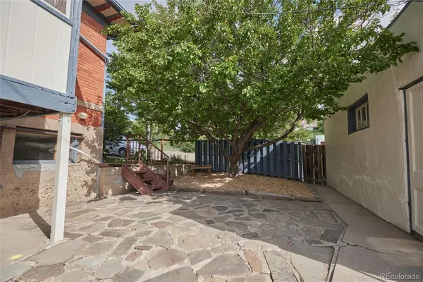 a view of a backyard with sitting area