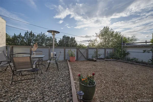 a view of a backyard of the house