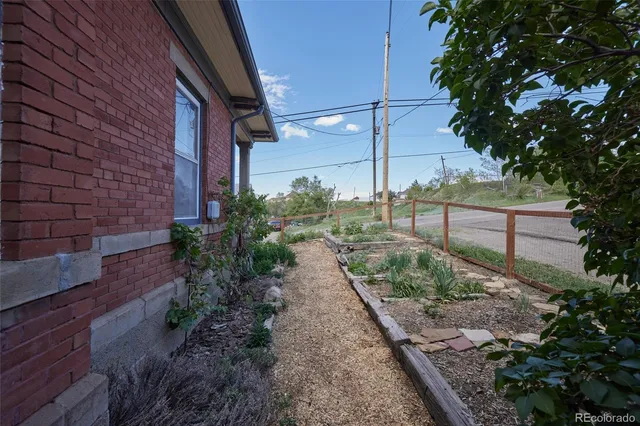 a view of a porch and garden