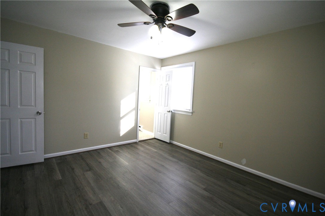12141 Old Buckingham Road Midlothian, VA 23113 - Photo 16 of 39 Spacious room featuring wood-finish flooring, neut