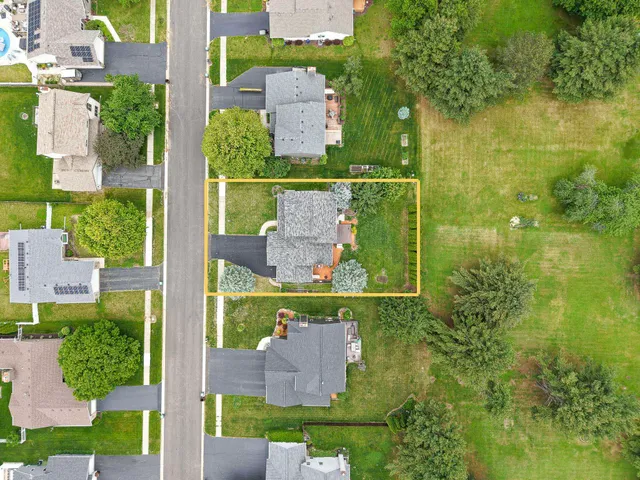 an aerial view of a house with a garden