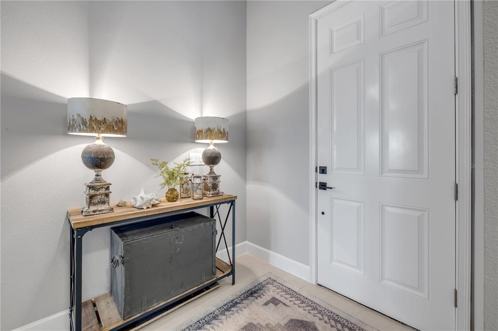 195 Azure Mist Way Daytona Beach, FL 32124 - Photo 11 of 63 a view of living room with stainless steel appliances wooden floor and chair