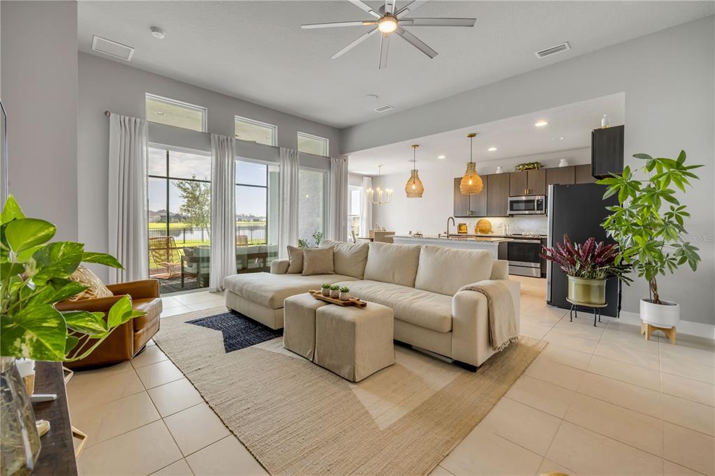 195 Azure Mist Way Daytona Beach, FL 32124 - Photo 12 of 63 a living room with furniture potted plant and a window
