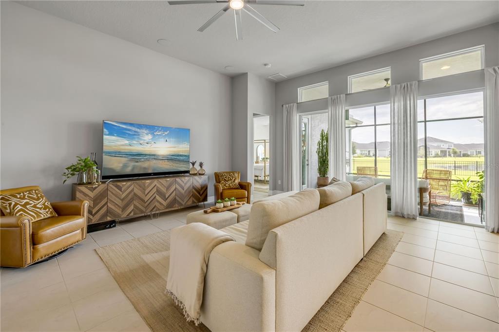 195 Azure Mist Way Daytona Beach, FL 32124 - Photo 13 of 63 a living room with furniture and a flat screen tv