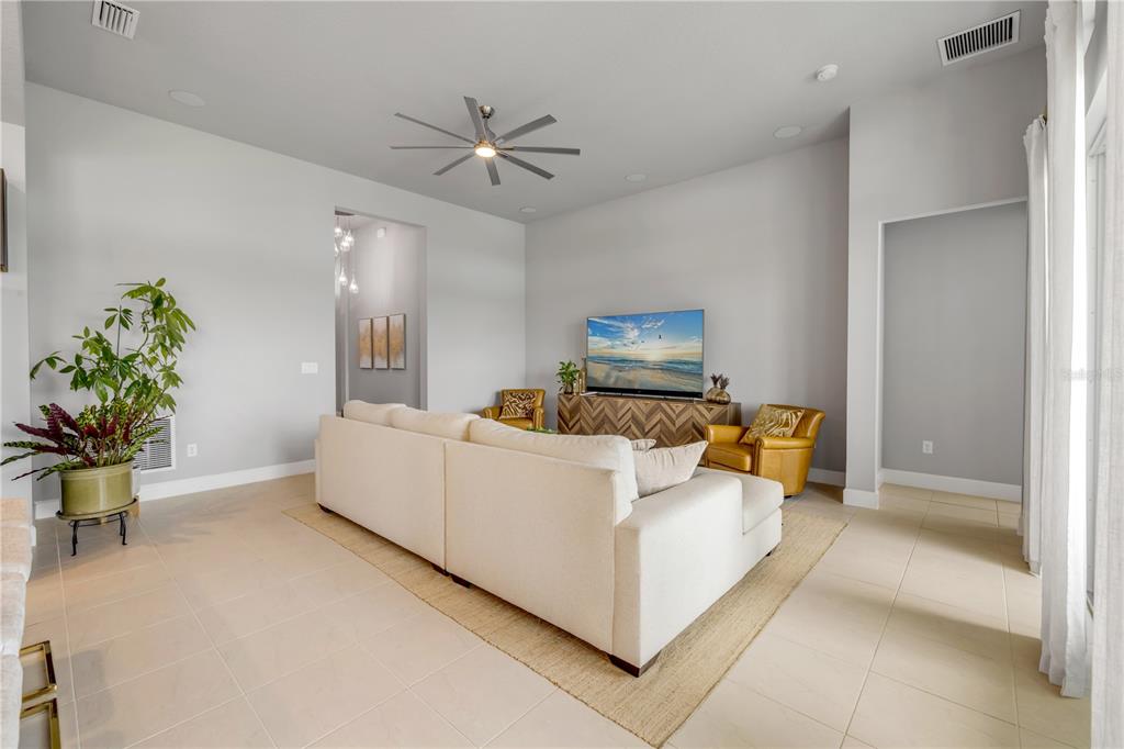 195 Azure Mist Way Daytona Beach, FL 32124 - Photo 14 of 63 a living room with furniture and a potted plant