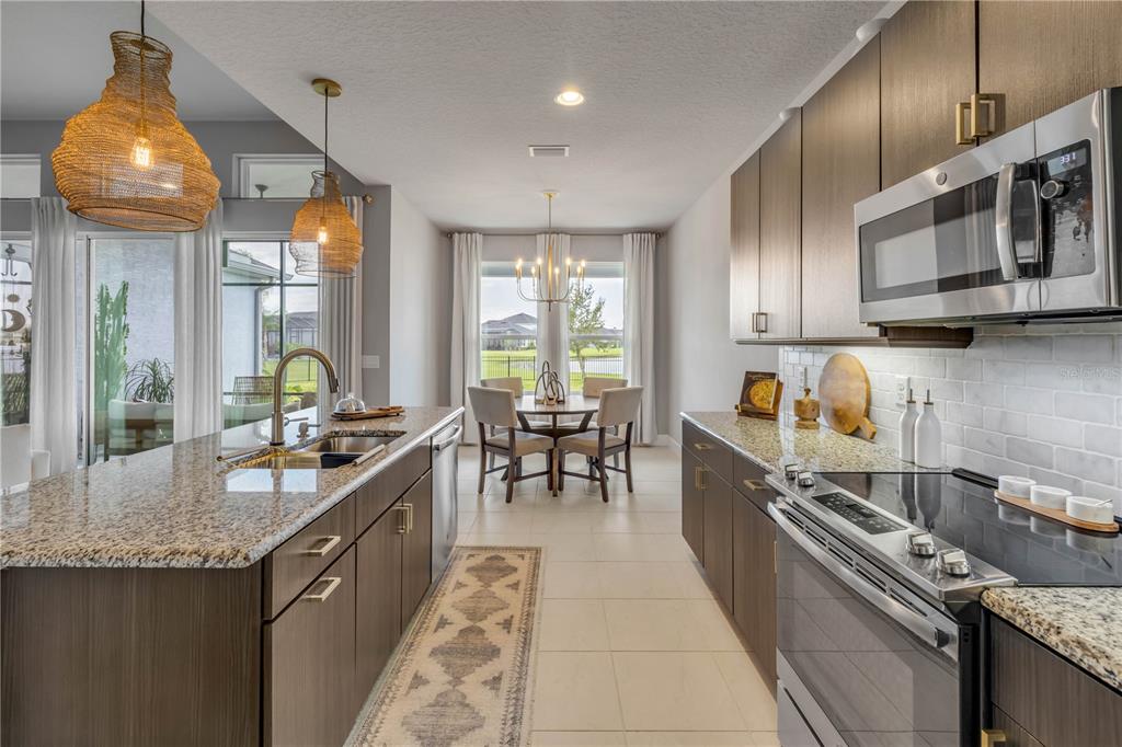 195 Azure Mist Way Daytona Beach, FL 32124 - Photo 25 of 63 a kitchen with granite countertop lots of counter top space