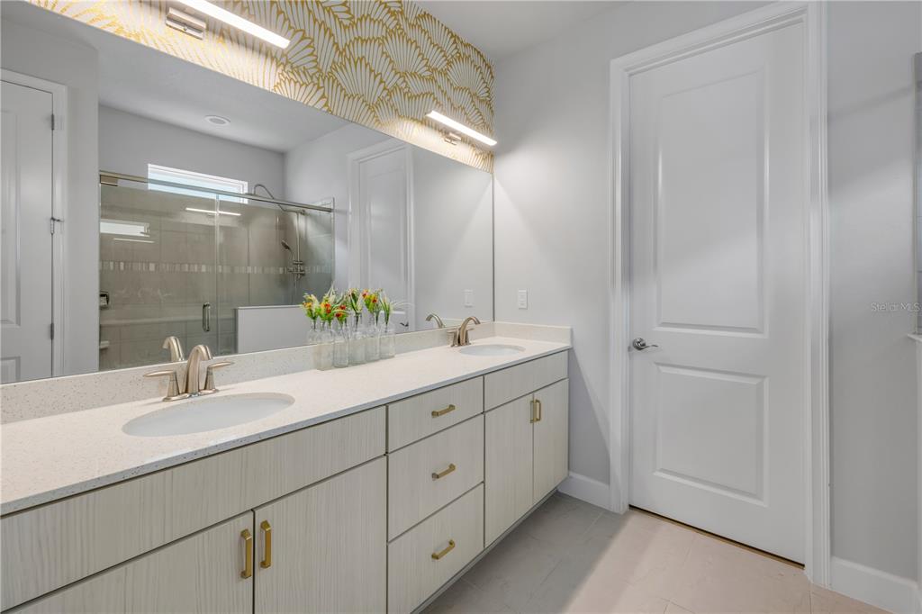 195 Azure Mist Way Daytona Beach, FL 32124 - Photo 35 of 63 a bathroom with a double vanity sink and mirror