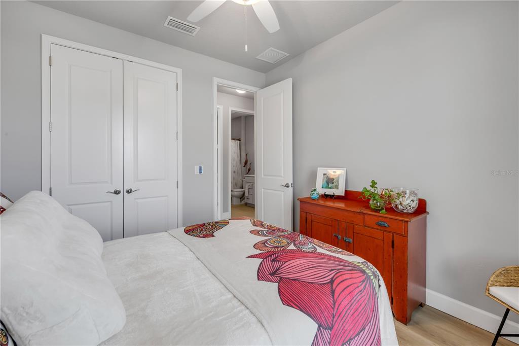 195 Azure Mist Way Daytona Beach, FL 32124 - Photo 39 of 63 a bedroom with a bed and a window