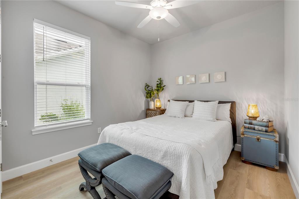 195 Azure Mist Way Daytona Beach, FL 32124 - Photo 40 of 63 a bedroom with a bed and a chair