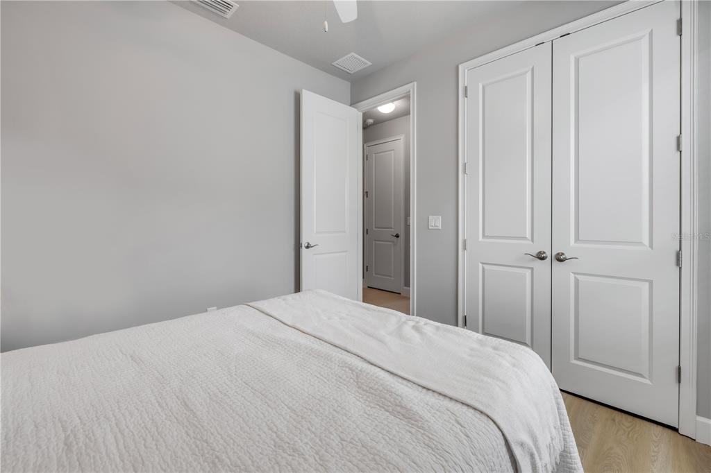 195 Azure Mist Way Daytona Beach, FL 32124 - Photo 41 of 63 a bedroom with a bed and a shower