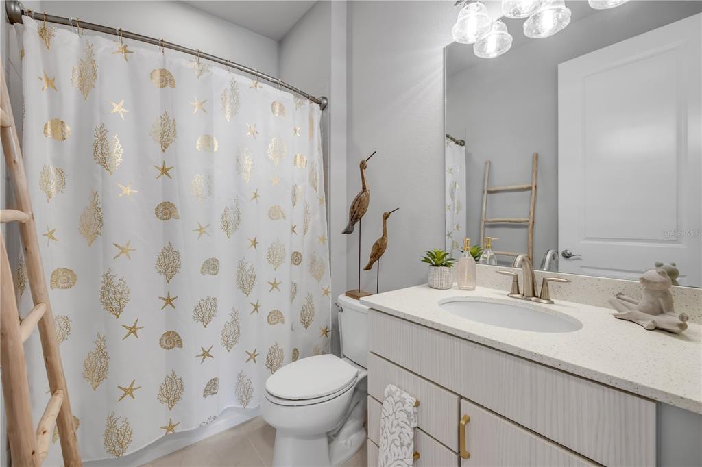 195 Azure Mist Way Daytona Beach, FL 32124 - Photo 42 of 63 a bathroom with a sink toilet and shower