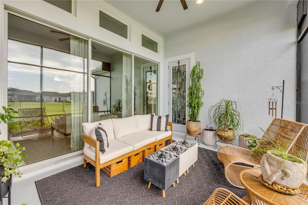 195 Azure Mist Way Daytona Beach, FL 32124 - Photo 45 of 63 a living room with furniture city view and large windows