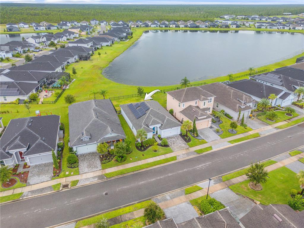 195 Azure Mist Way Daytona Beach, FL 32124 - Photo 58 of 63 an aerial view of residential houses with outdoor space and swimming pool