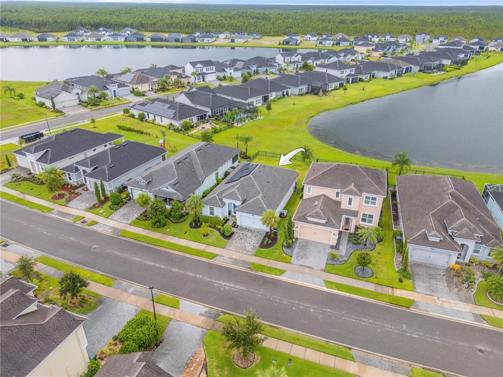 195 Azure Mist Way Daytona Beach, FL 32124 - Photo 59 of 63 an aerial view of residential houses with swimming pool